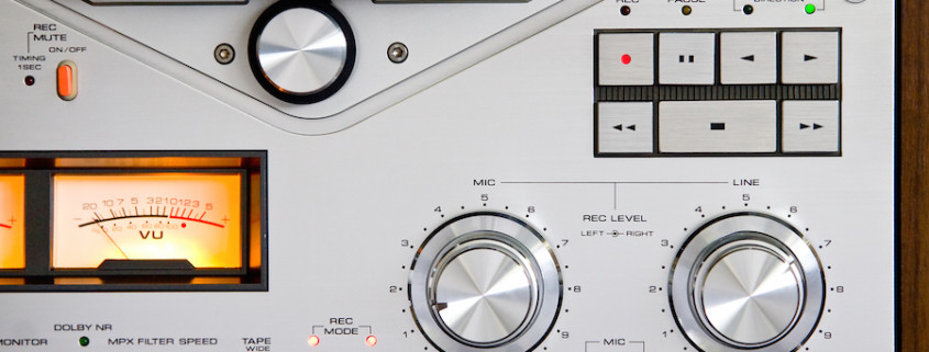 Vintage reel-to-reel tape recorder deck controls