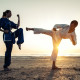 Couple Training In Martial Arts On The Beach