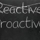 Crossing Out Reactive And Writing Proactive On A Blackboard.