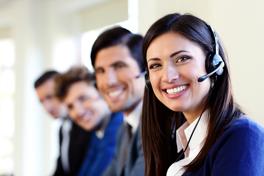 Cheerful young businesspeople and colleagues in a call center of 24 Hour Live Answering Service