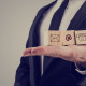 Businessman Holding Three Wooden Cubes With Contact Symbols